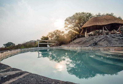 Rwakobo Rock Lodge thatched cottage scenic ledge Lake Mburo National Park Uganda