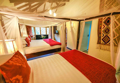 The Boma Entebbe exclusive luxury rooms local artwork hand-carved furniture Uganda
