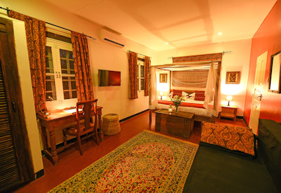 The Boma Entebbe large luxurious bedroom four-poster bed mosquito net solar hot water Uganda