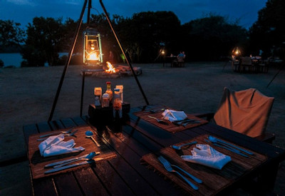 The Bush Lodge outdoor fireplace romantic starlit sky Queen Elizabeth Uganda