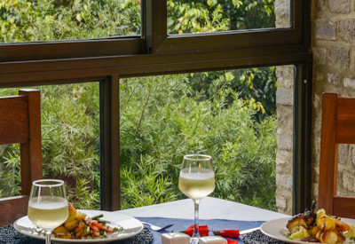 Trackers Safari Lodge dining area Bwindi Forest views open kitchen Uganda
