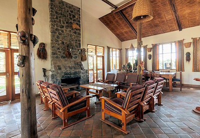 Travellers Rest Hotel lounge fireplace library books wildlife conservation Uganda