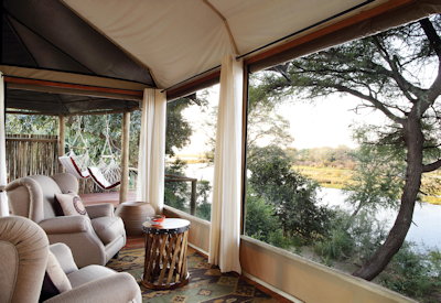 Amanzi Camp raised timber walkway Lower Zambezi views Ngwenya Channel Zambia
