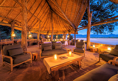 Delicious gourmet safari meals served al fresco on the wooden viewing deck at Chamilandu Bushcamp