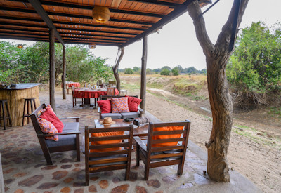 Panoramic wilderness views from the central wooden guest area deck at Chikoko Tree Trails Camp