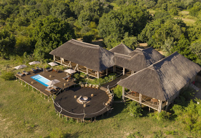 Elegant and modern suite interior with a plush king-sized bed and premium furnishings at Chikunto Safari Lodge
