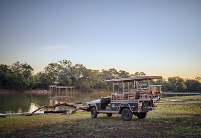Chindeni Bushcamp scenic dining deck looking out across the active lagoon toward the Chindeni Hills