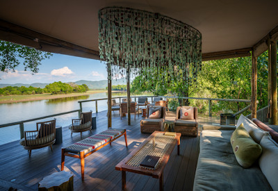 Modern luxury en-suite bathroom with a spacious walk-in shower inside a tented suite at Chindeni Bushcamp
