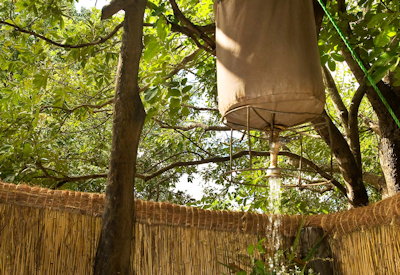 Kafunta Island Bush Camp authentic bucket shower open-air bathroom South Luangwa Zambia
