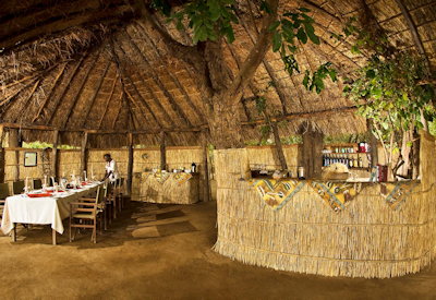 Kafunta Island Bush Camp thatched dining area lounge bar Luangwa River firepit Zambia