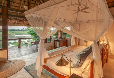 Kafunta River Lodge large bedroom mezzanine day beds luxury suite South Luangwa Zambia