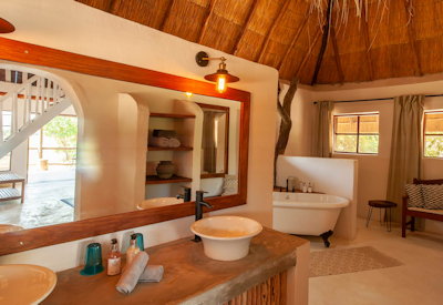 Kafunta River Lodge en-suite freestanding bath his-and-hers basins luxury suite Zambia