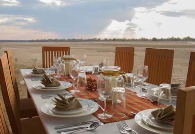 Kafunta Three Rivers Camp candlelit dinner river's edge Luangwa South Luangwa Zambia
