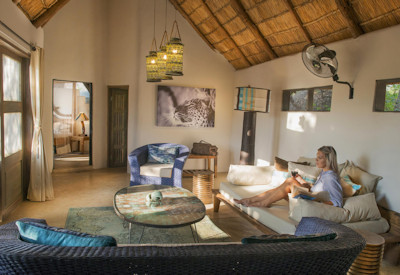 Luxury Kaingo Camp open-fronted chalet interior featuring premium linens and private views