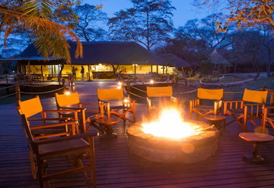 Kaingu Lodge outdoor firepit Kafue River after-dinner drinks Kafue National Park Zambia