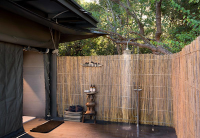 King Lewanika Lodge indoor outdoor shower solar powered Liuwa Plain National Park Zambia