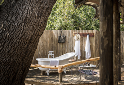 An inviting swimming pool on the wooden deck overlooking the river at Kulandila Camp safari lodge