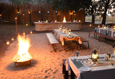 Cosy evening firepit and lounge area perfect for sharing safari stories under the spectacular African stars at Lion Camp