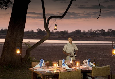 Luangwa River Camp outdoor dining wooden deck swimming pool Luangwa River Zambia