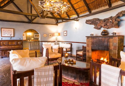 Mukambi Safari Lodge thatched central area dining fireplace lounge Kafue River views Zambia