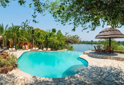 Mukambi Safari Lodge pool Kafue River boat cruise sunset game drive fishing Zambia