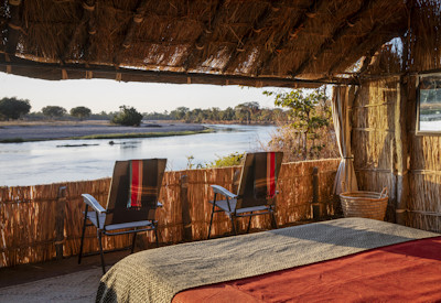 Guided walking safari exploring the wild terrain of North Luangwa with an expert guide from Mwaleshi Camp