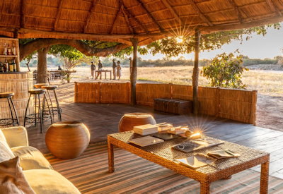 Delicious safari meals and refreshing drinks served outdoors in the dry riverbed at Nsolo Camp