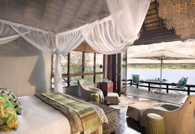 Royal Chundu Zambezi River Lodge thatched suite twin showers outdoor bath Zambia
