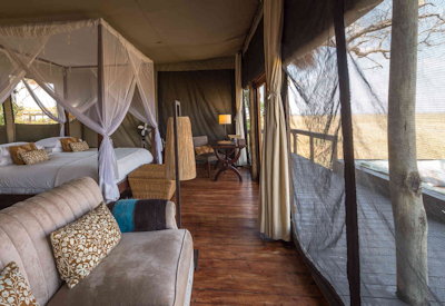 Shumba Camp large spacious tented suite raised platform Busanga Plains views Zambia