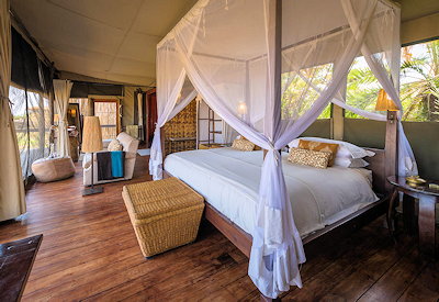 Shumba Camp luxury suite raised wooden platform panoramic Busanga Plains Kafue Zambia