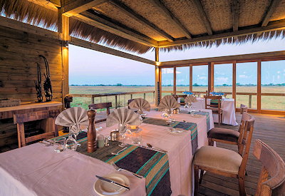 Shumba Camp thatched dining area 6 luxury suites 12 guests maximum Busanga Plains Zambia