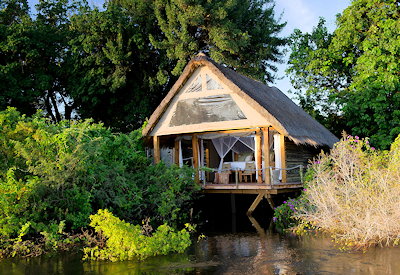 Sindabezi Island Camp rustic thatched camp arrived by canoe or boat Zambezi Zambia