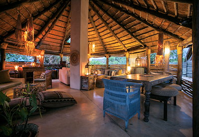 Sindabezi Island Camp thatched lounge bar indoor dining Zambezi River island Zambia