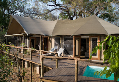 Private plunge pool on the expansive wooden viewing deck of a luxury chalet at Sungani Lodge