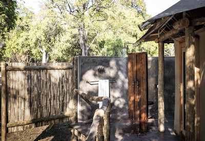 High end custom canvas safari tents blending seamlessly into the riverine forest at Sungani Lodge