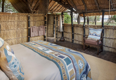Comfortable and uniquely designed thatched cottages offering stunning wilderness views at Tafika Camp