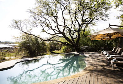 Toka Leya Camp infinity pool sundeck pool deck Zambezi River Livingstone Zambia