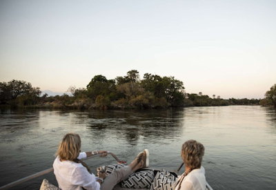 Toka Leya Camp game drives rhino tracking sunset cruise wood-burning pizza oven Zambia