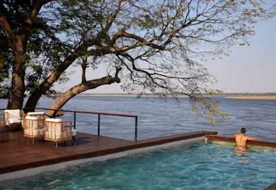 Zambezi Grande swimming pool overlooking Zambezi River Lower Zambezi National Park Zambia
