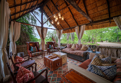 Attentive lodge staff providing premium hospitality and high-end guest service at Zungulila Bushcamp