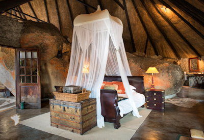 Amalinda Lodge large thatched suite built within granite boulders Matobo Hills Zimbabwe