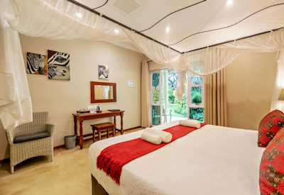 Bayete Guest Lodge generously sized queen room local charm mosquito nets Zimbabwe