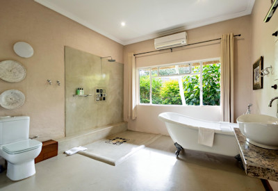 Bayete Guest Lodge large en-suite Victorian clawfoot bath shower Victoria Falls Zimbabwe