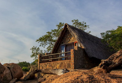 Big Cave Camp granite A-frame cabins panoramic views Matobo Hills Zimbabwe