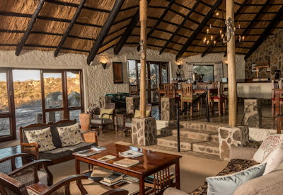 Big Cave Camp thatched central area bar fireplace library Matobo Hills Zimbabwe