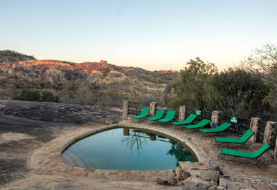 Big Cave Camp natural rock swimming pool sun deck Matobo Hills Zimbabwe