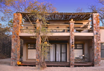 Camelthorn Lodge double-storey forest villa spiral staircase rooftop sleeping stars Zimbabwe
