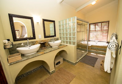 Camelthorn Lodge en-suite bath shower fireplace minibar Hwange Zimbabwe