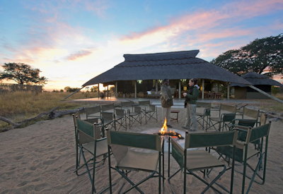 Camp Hwange firepit after-dinner drinks Sinamatella concession Hwange Zimbabwe