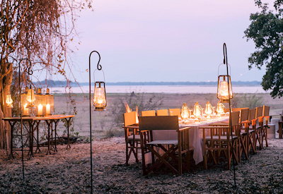 Chikwenya Camp outdoor dining area firepit Sapi Zambezi confluence Mana Pools Zimbabwe